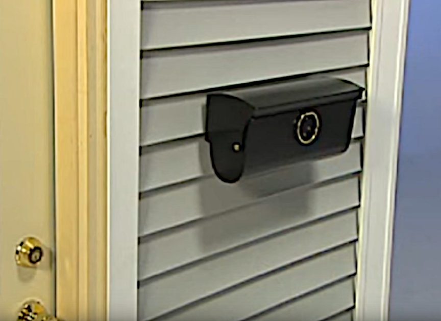 a letterbox attached to vinyl siding