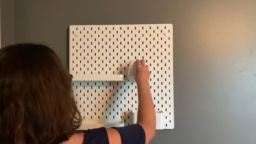 adding accessories to pegboard