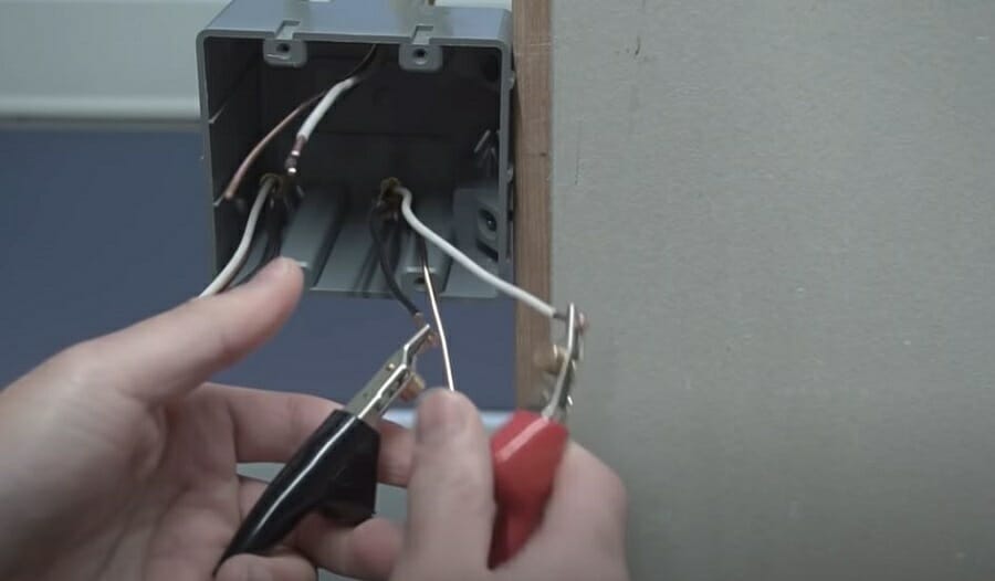 connecting the alligator clips to the hot and neutral wires