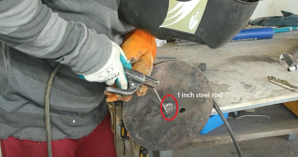 connecting the steel rod to the disk