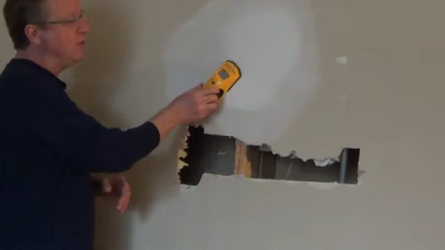 employing a wire or stud finder