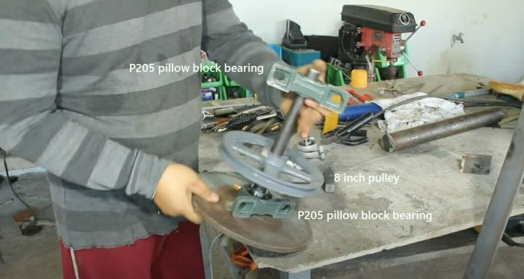inserting one P205 pillow block bearing