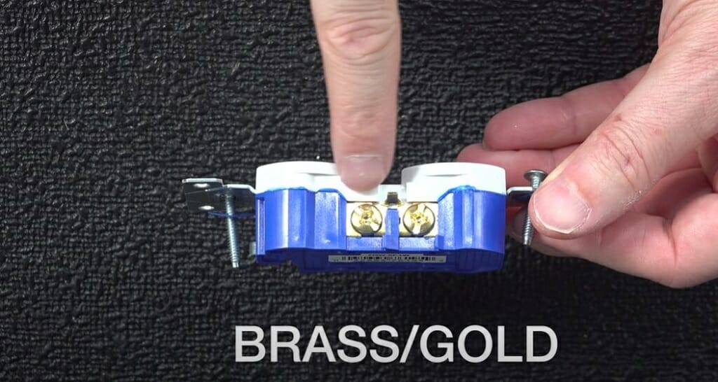 outlet's brass/gold screw