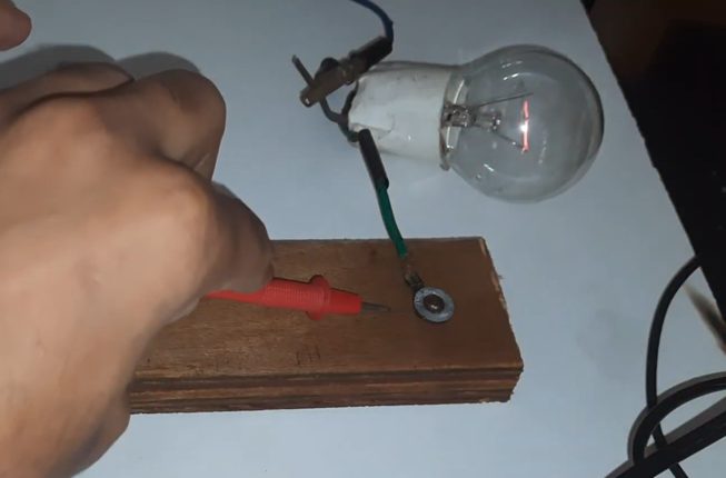 testing electricity on wood