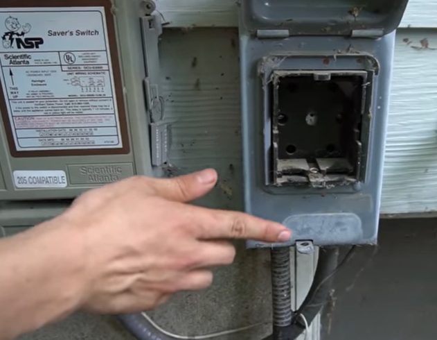 a hand pointing to a bad circuit breaker