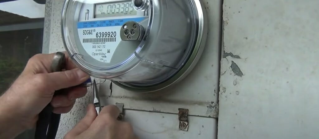 cutting and breaking the electric meter tamper tag