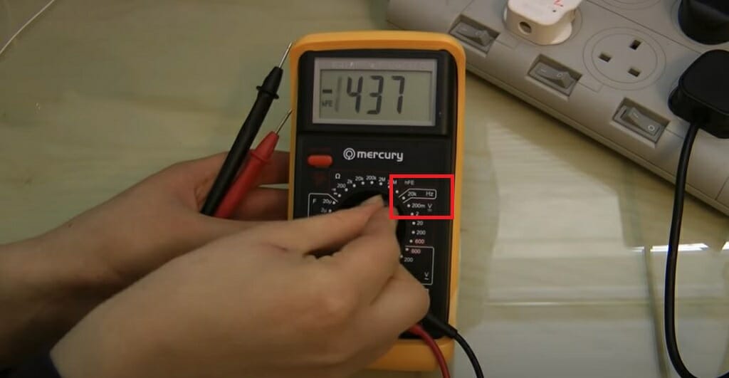 dialing the multimeter to the Hz area