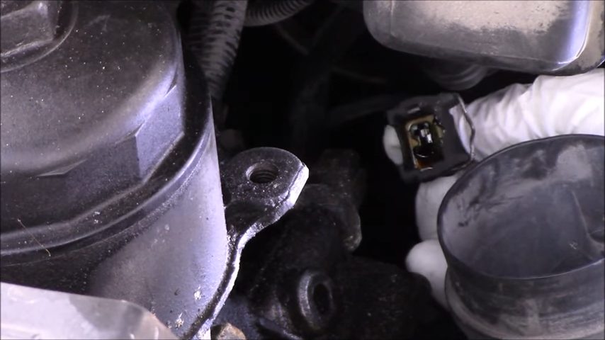 disconnecting the oil pressure sensor's electrical connector