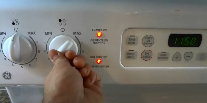 turning on the GE electric stove