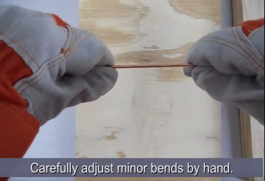 bending and adjusting copper wire by hand
