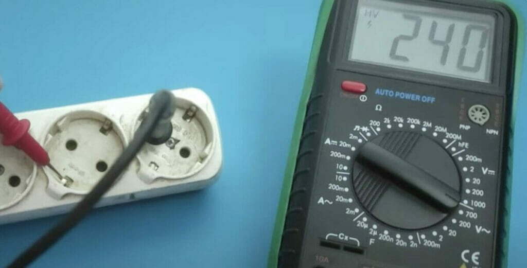 multimeter testing outlet with 240 reading
