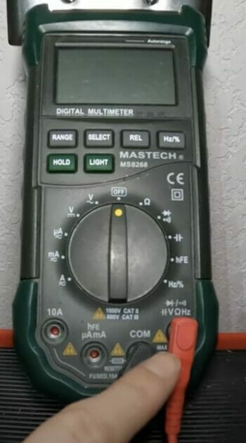 plugging the connectors into the multimeter