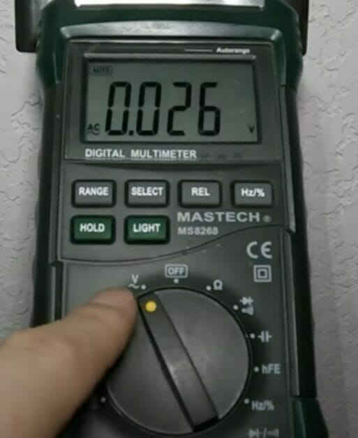 setting the multimeter to measure AC voltage