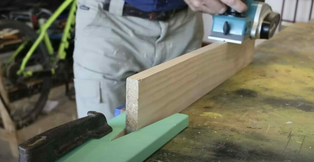 stripping the wood using an electric planer