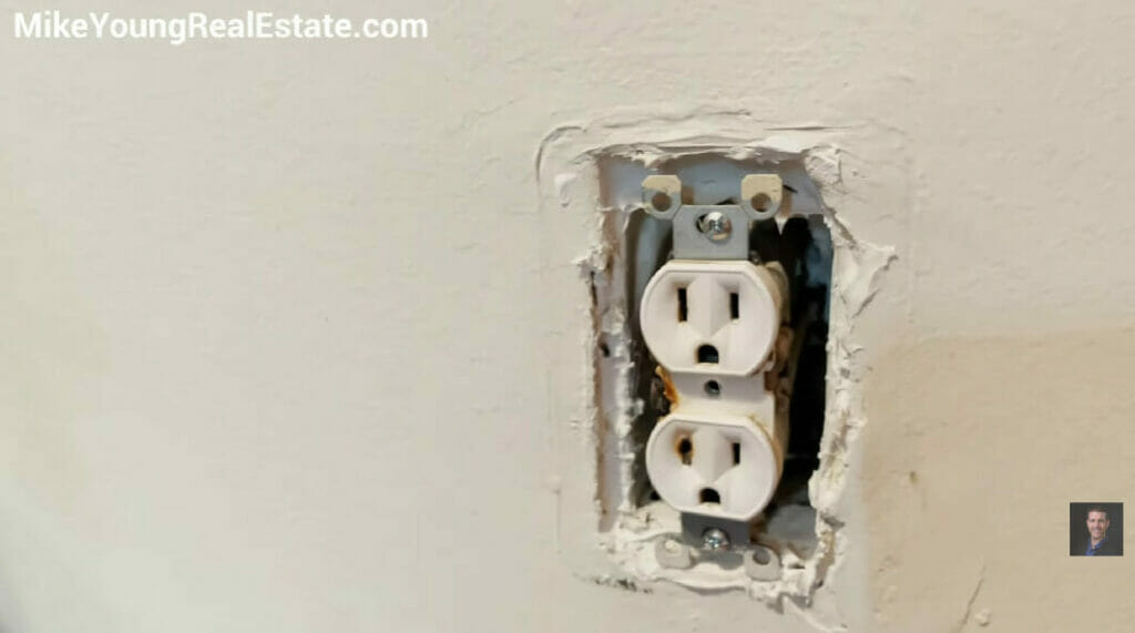 a damaged wall outlet