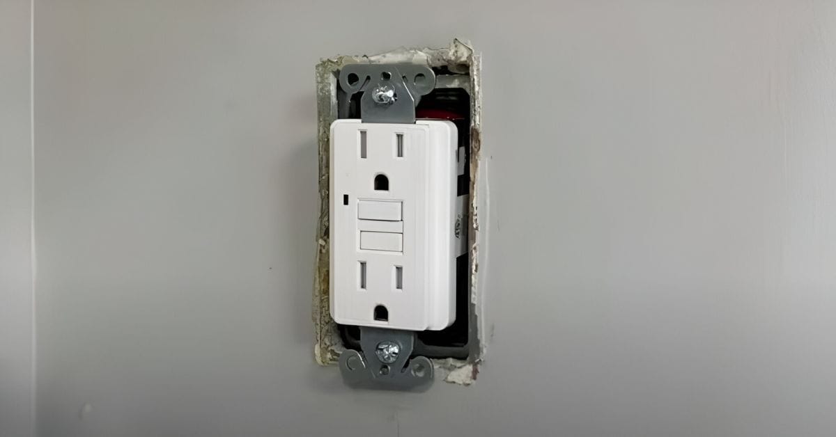 An uncovered wall outlet