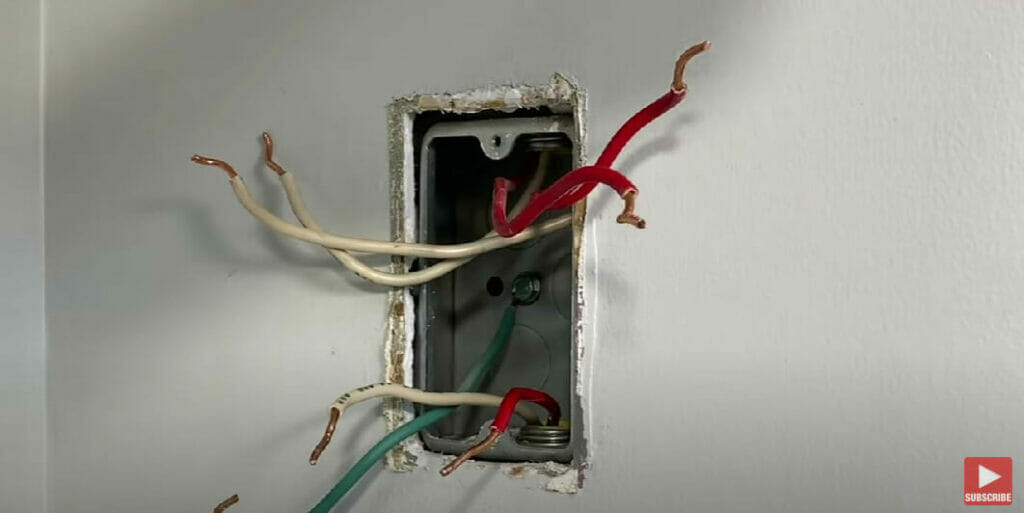 an undone wiring of a wall electrical outlet