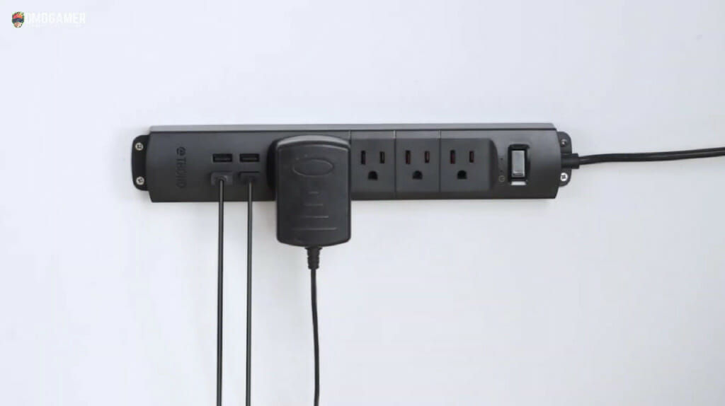 black outlet's extension wire mounted on the wall