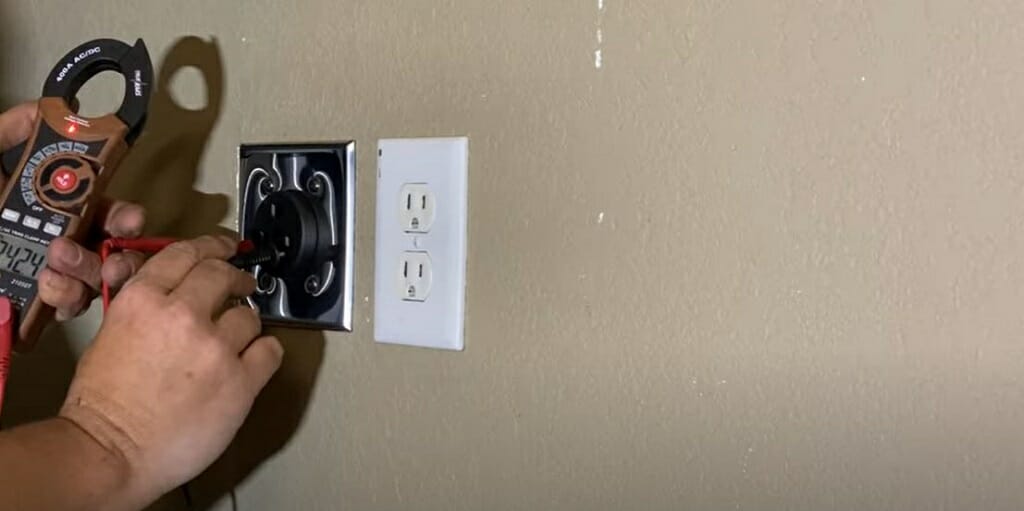 checking the new outlet with a multimeter