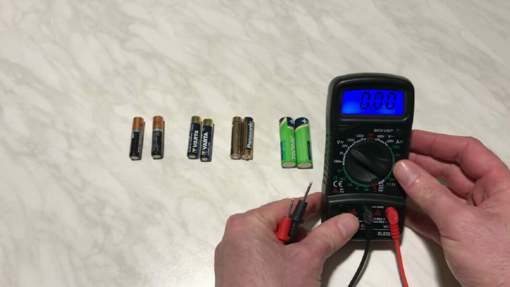 checking voltages of an aaa batteries using multimeter
