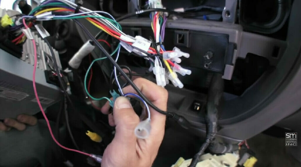 connecting the lever to one end of the parking brake wire