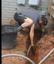 man connecting the conduit