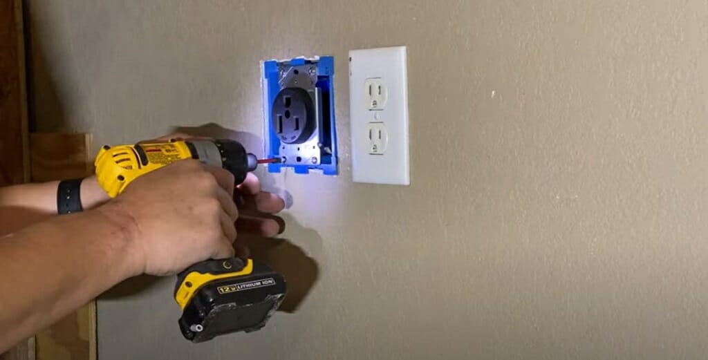 screwing and securing the outlet