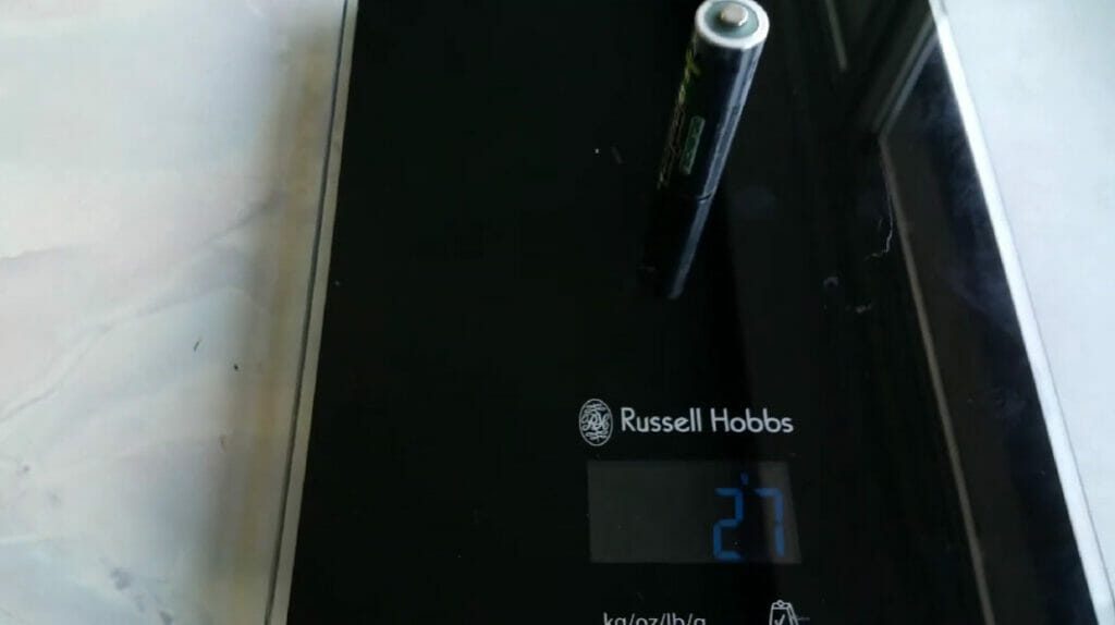 weighing an aa battery using russell hobbs scale