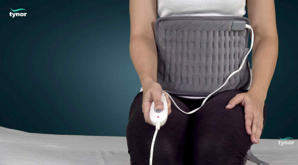 woman holding the hot pad control device