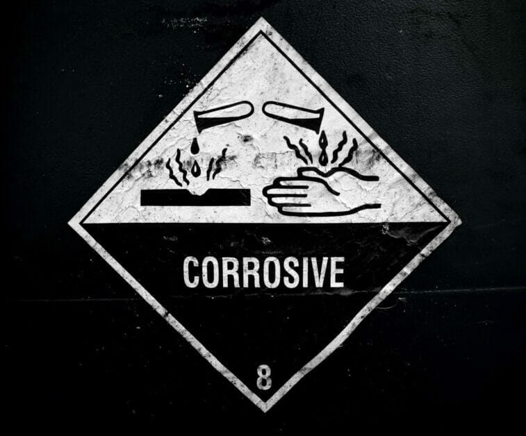 corrosive material at the acid container sign
