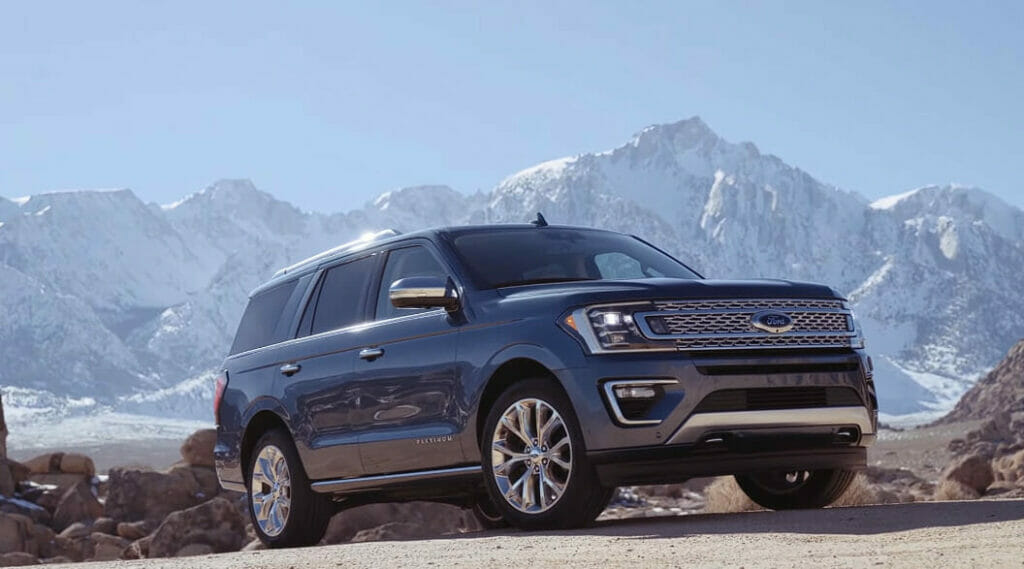 FORD SUV parked at the hills with mountain as backdrop