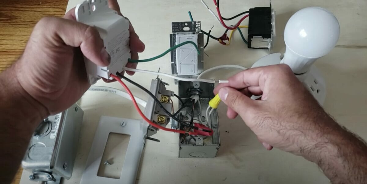 man doing a wiring for a light switch