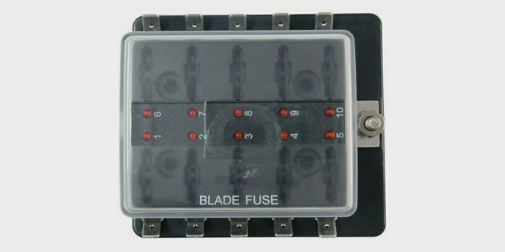 A black box housing a blade fuse for wiring purposes