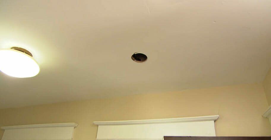A drilled hole on the ceiling for smoke detector