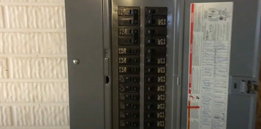 A zoom in image of an electrical panel on the wall