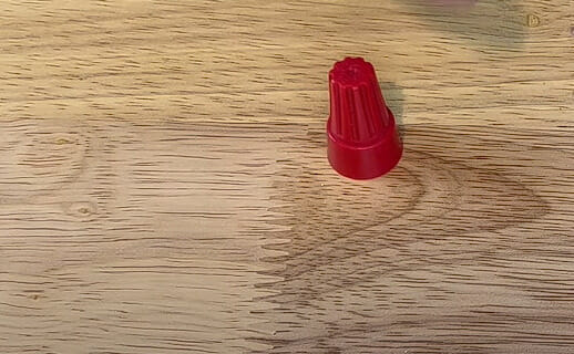 A red wire nut on the table