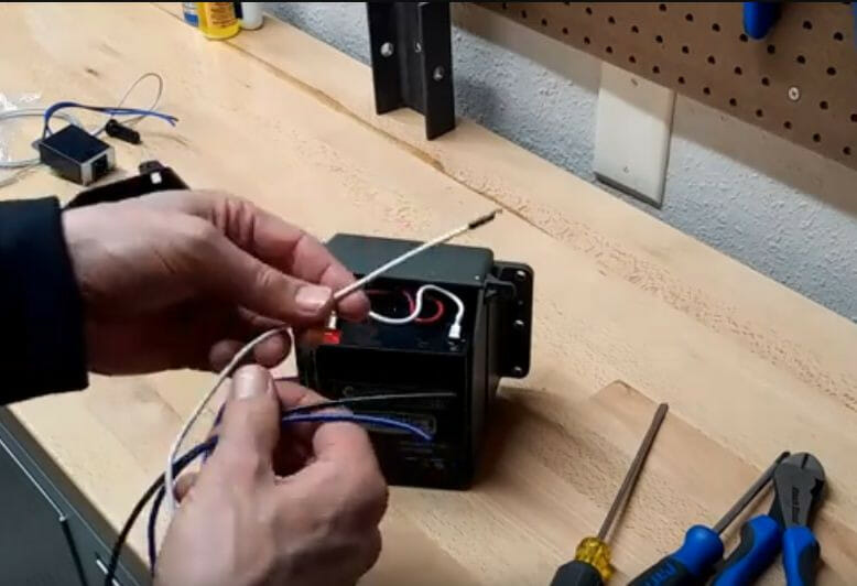 A person working on a battery box 