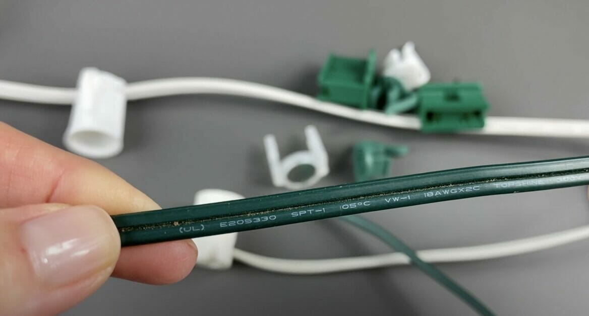 A woman holding an SPT1 wire in green color