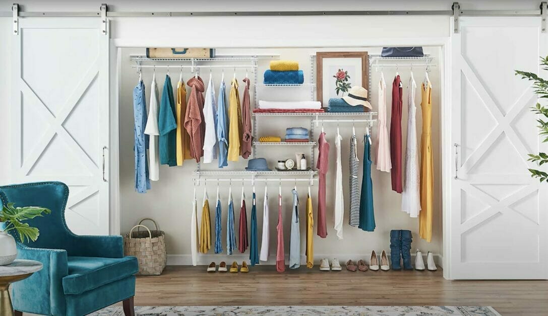 A wire shelves with clothes hang on it