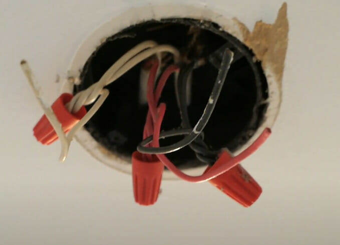 An undone wiring at the ceiling ready for smoke detector installation