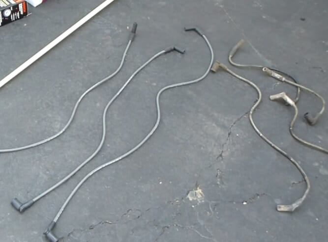 A spark plug wires placed on the ground