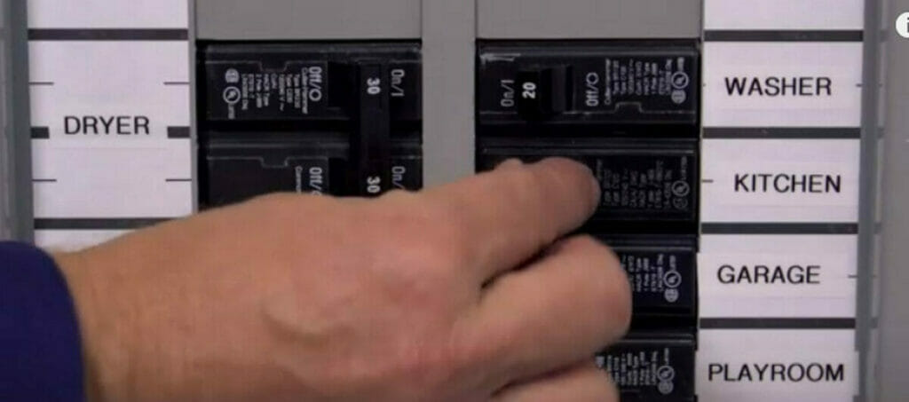 A person closing the main power from circuit breaker