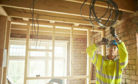 A construction worker is using TFFN wire for house wiring