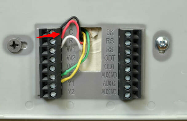 An open thermostat showing its wires