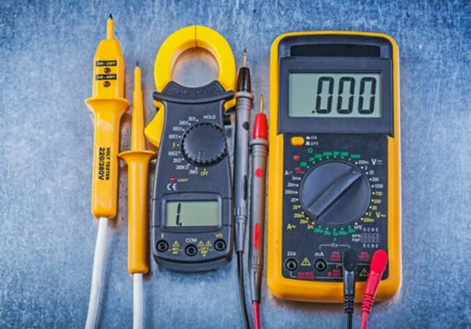 A multimeter on a metal surface