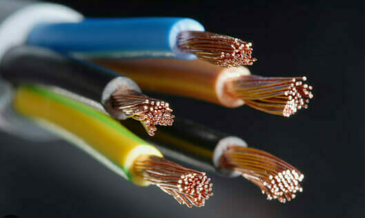 A close up of different colored wires