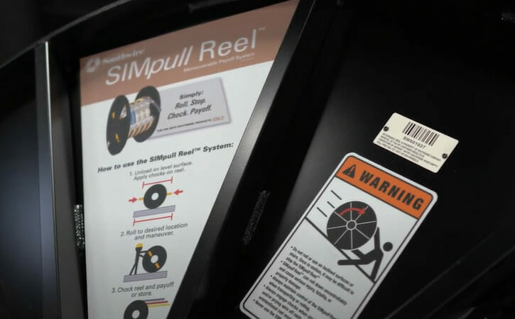 A SIMpull Reel label with warning sign
