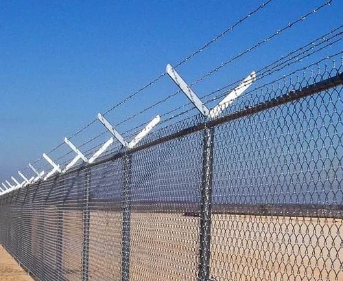 A barbed wire fence in a desert