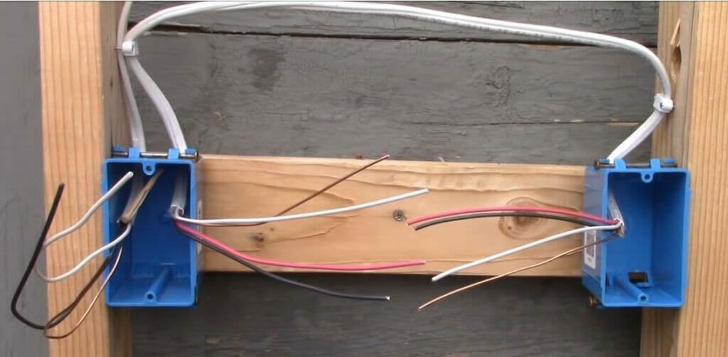 Two blue box side by side with connected wires