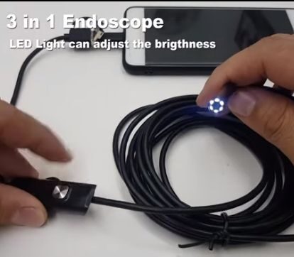 A person checking the 3-in-1 endoscope
